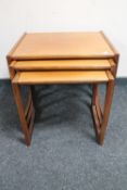 A nest of three mid twentieth century teak G-plan tables