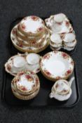 Two trays of fifty-six pieces of Royal Albert Old Country Roses tea and dinner china
