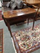 A George III inlaid mahogany tea table,