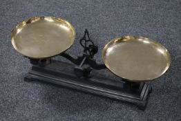 A set of antique cast iron pan scales