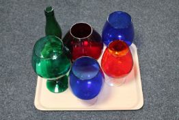 A tray of six hand coloured glass vases,
