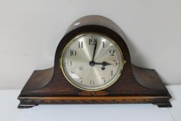 A 1930's oak cased mantel clock