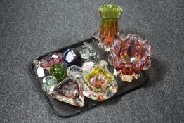 A tray of five glass paperweights,