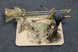 A set of Victorian brass fire dogs with four brass companion pieces,