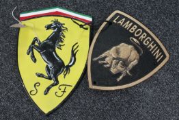 Two cast iron Ferrari and Lamborghini signs CONDITION REPORT: Ferrari 29cm by 19cm.