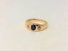 An 18ct gold diamond and sapphire three stone ring, size N CONDITION REPORT: 10.