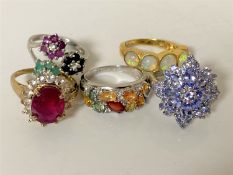 Five silver dress rings set with gemstones