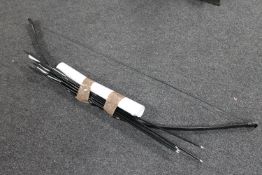 An archery bow together with six D&Q arrows