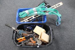 Two baskets of hand tools, spirit levels,