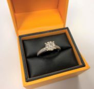 An 18ct white gold diamond cluster ring, approximately 0.