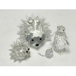 Two Swarovski crystal hedgehogs together with two penguins (a/f)