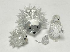 Two Swarovski crystal hedgehogs together with two penguins (a/f)