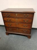 A George III mahogany chest of four drawers,