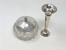 A silver lidded cut glass sugar pot and a silver trumpet vase, height 12.