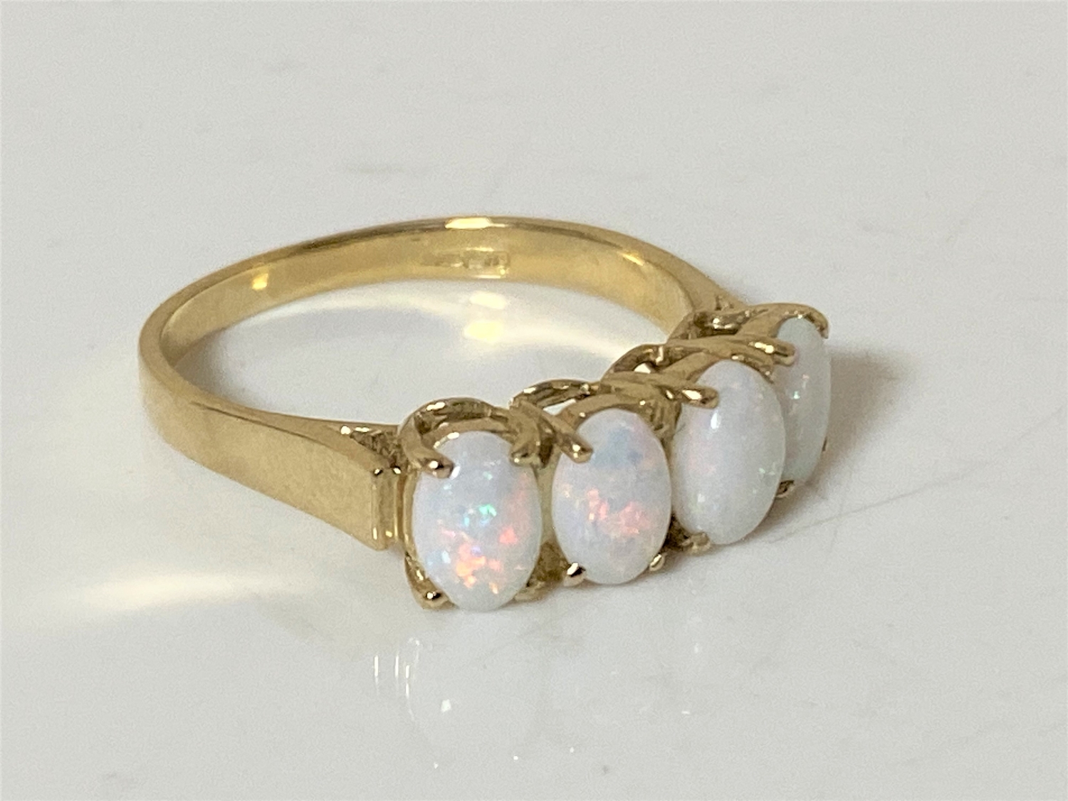 A 9ct gold opal ring, size O CONDITION REPORT: 2.