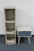 A set of contemporary open bookshelves together with a lamp table