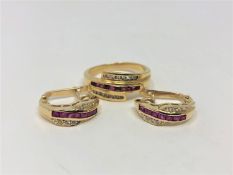 An 18ct gold diamond and ruby set ring, size R,