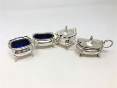 A matched silver four piece cruet set,