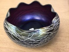 An iridescent Austrian amethyst glass bowl in the manner of Loetz,