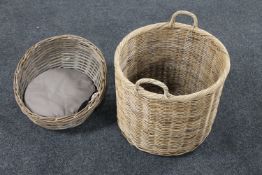 A wicker cat basket together with a twin handled log basket