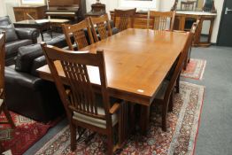 A contemporary Barker and Stonehouse inlaid oak extending dining table with leaf,
