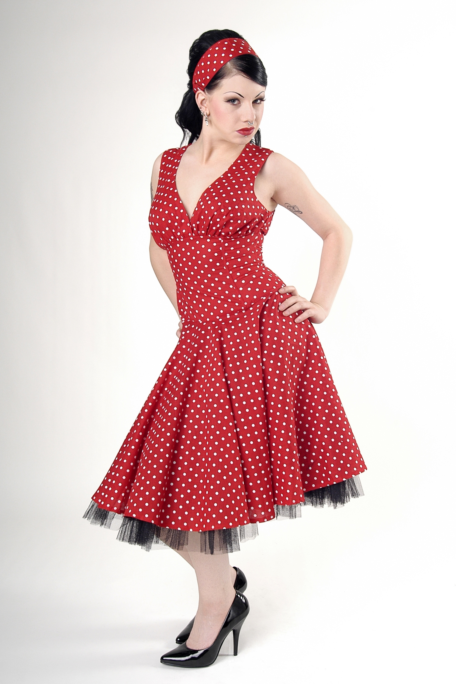 Sixteen red and black polka dot dresses,