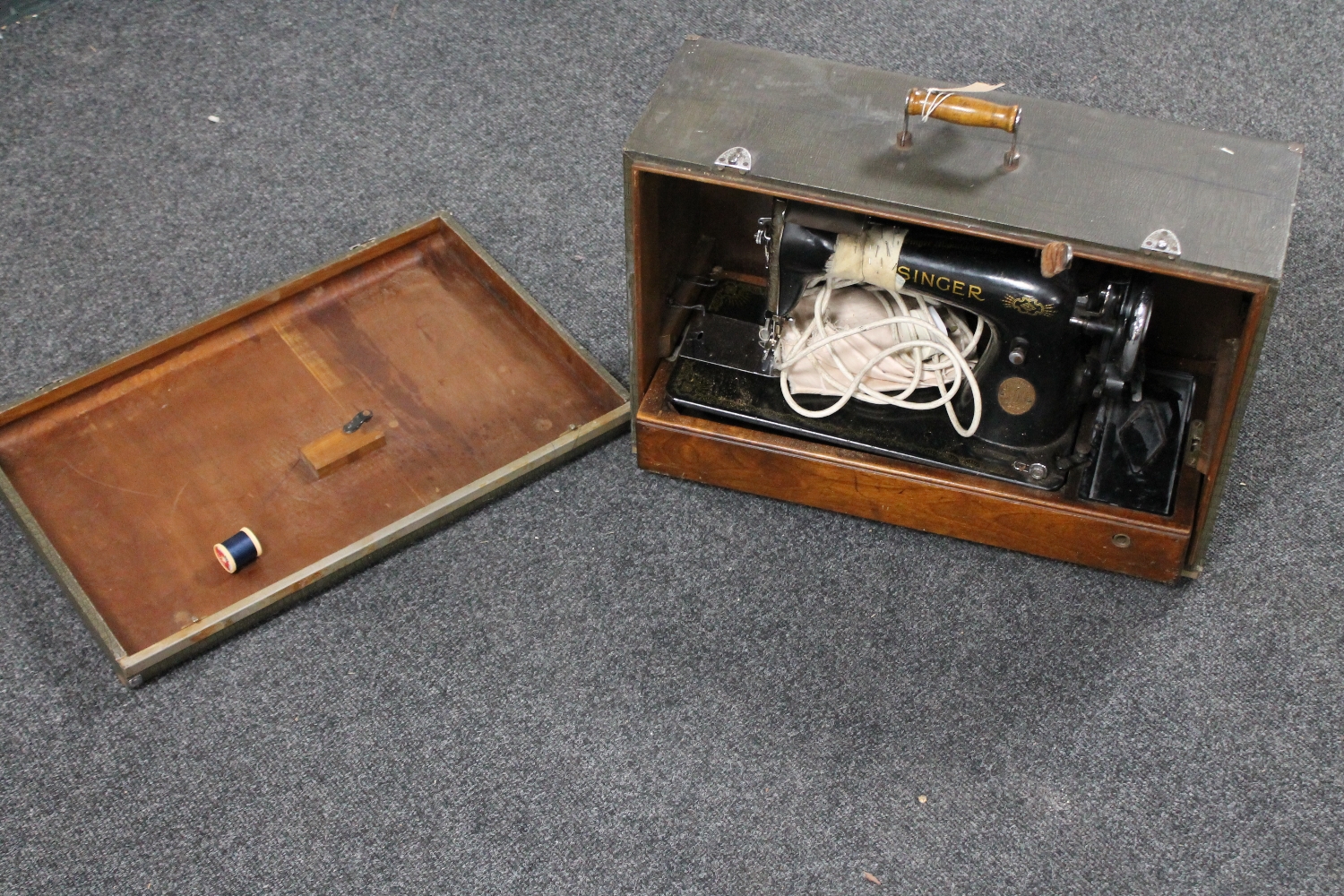 A cased mid twentieth century Singer sewing machine