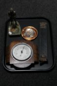 A tray of oak cased Art Deco barometer, table lighter in the form of a knight, onyx ashtray,