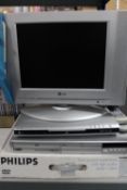 An LG 15" LCD TV with remote together with three DVD players, Sanyo,