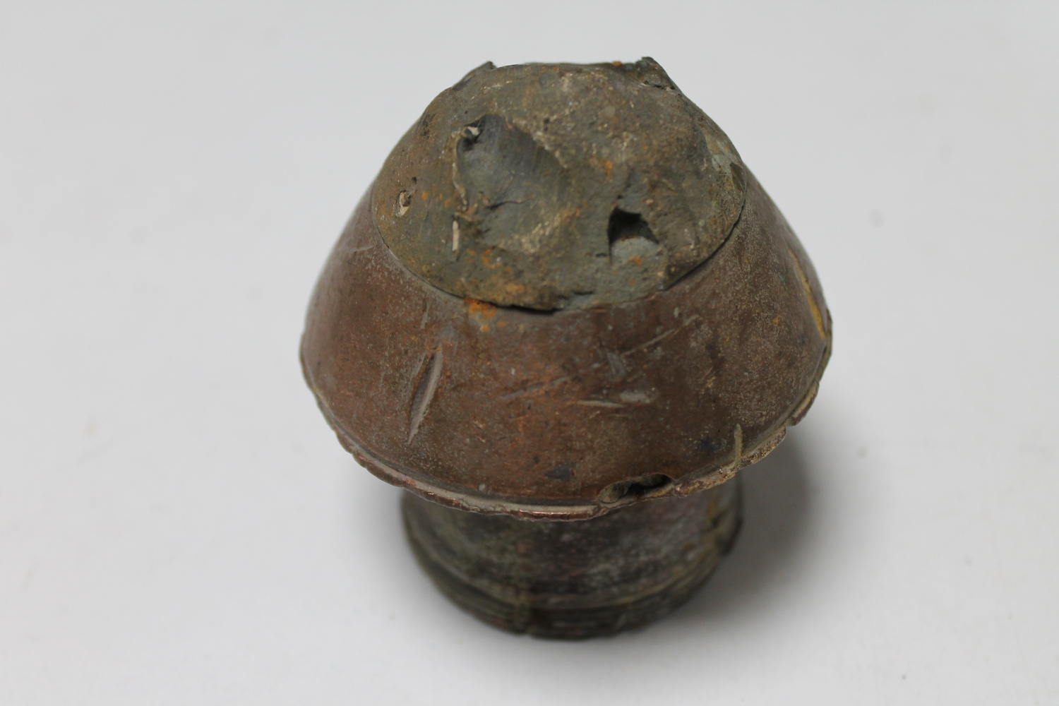 A World War I trench art paperweight fuse tip