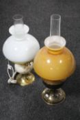 A brass Aladdin oil lamp with glass shade and chimney together with a further brass and marble oil