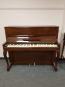 A mahogany cased upright overstrung piano by Danemann,