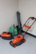 A power base garden vac together with a flymo lawn mower and hose on reel