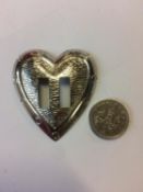 A large quantity of metal heart shaped belt buckles (in one box)