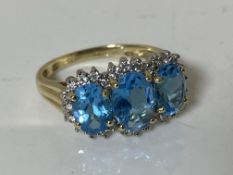 A 9ct gold blue topaz ring, size O CONDITION REPORT: 3.0g. Central stone 5.98mm by 7.