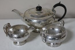 A three piece silver tea service, Walker and Hall,