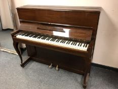 A mahogany cased upright overstrung piano by Danemann,