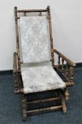 An early 20th century American style rocking chair