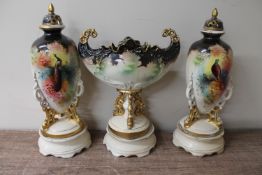 A three piece Victorian transfer printed vase garniture on stands CONDITION REPORT: