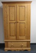 A pine double door hanging wardrobe