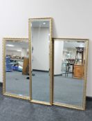 A gilt frame bevelled hall mirror together with two further gilt framed mirrors