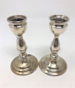 A pair of loaded silver candlesticks, Birmingham marks,