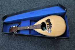 An Italian bowl-back mandolin in case,