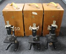 Three Prior microscopes in fitted wooden boxes (missing eye pieces)