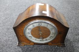A 1930's Bentima oak eight day mantel clock with silvered dial
