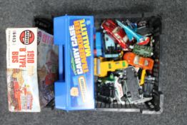 A box of play worn die cast vehicles,