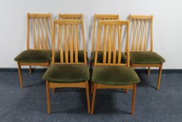 A set of six 20th century teak rail back dining chairs