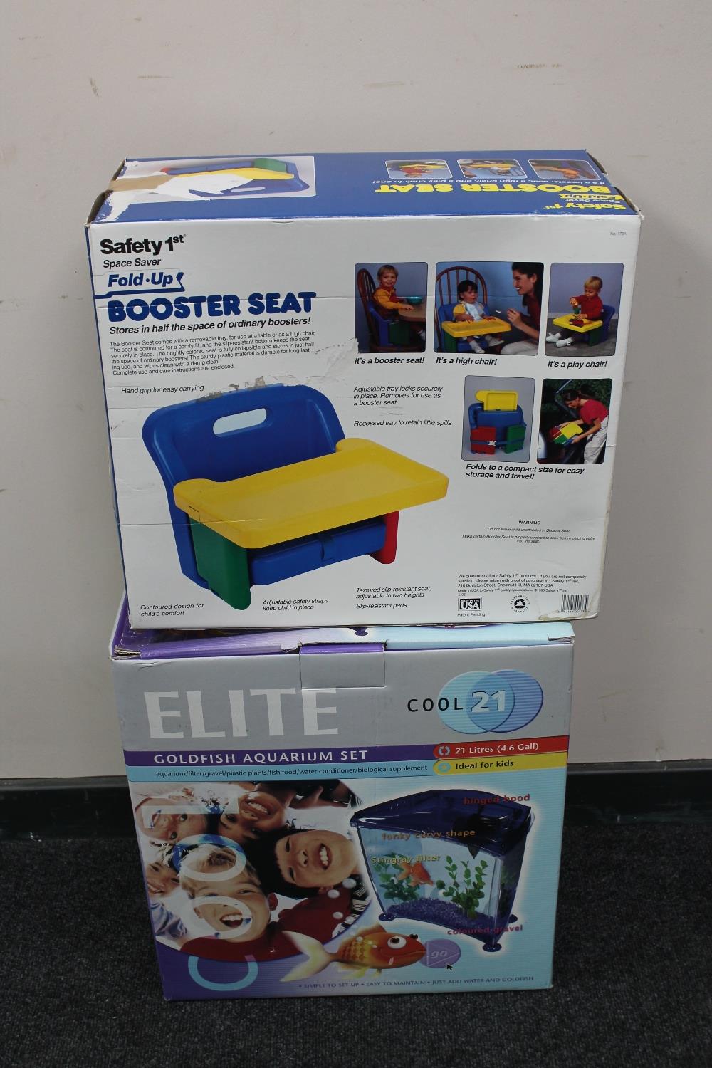 A boxed Elite Cool 21 goldfish aquarium set and a boxed booster seat
