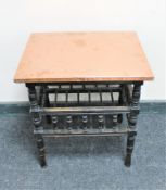 An Arts & Crafts ebonised copper topped book table