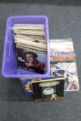 A box containing LP records - The Police, Rod Stewart, Moody Blues,